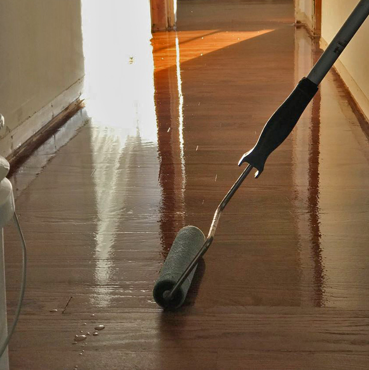 Hardwood floor refinishing in progress